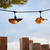 15 ft. Patio Stringer - Comes with (10) LED S14 Filament Bulbs and (10) Curved Iron Shades Thumbnail